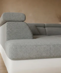 Canapé d'angle convertible Antoni avec têtières relevables angle gauche simili Blanc et tissus Gris clair