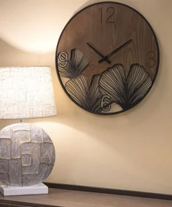 Horloge murale ronde métal et MDF noir et marron décor feuilles