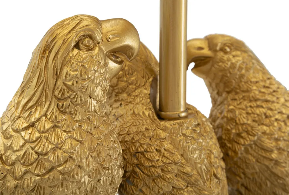 Lampe de sol dorée avec abat-jour en tissu noir et décor perroquets